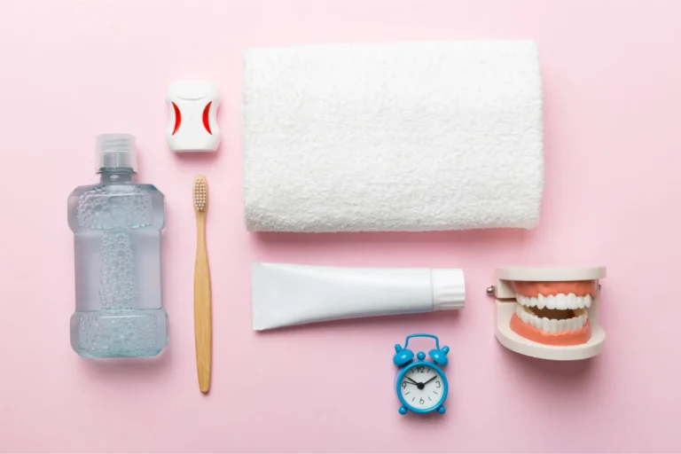 a close up of a toothbrush, toothpaste, toothpaste, and a tooth
