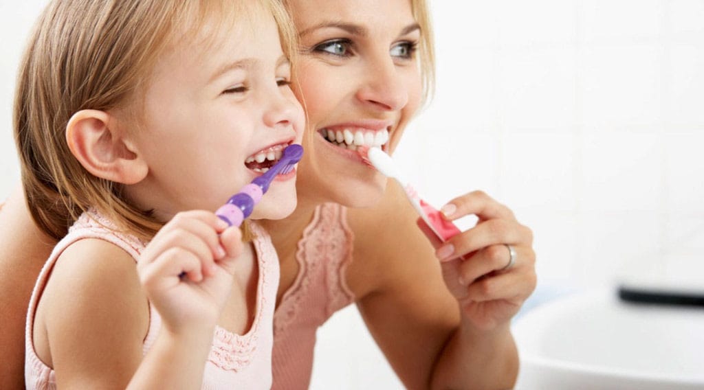 Mom and Daughter brushing teeth