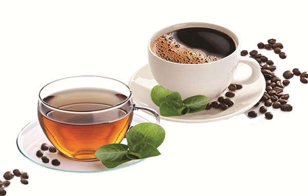 there is a cup of coffee and a cup of tea on a plate