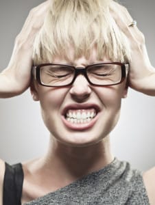 stressed-woman-holding-head